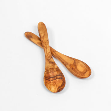 Handmade mini wooden spoon from olive wood, ideal for precisely seasoning dishes as a salt spoon or adding sugar and coffee. This eco-friendly choice reflects a commitment to sustainable living, offering a unique pattern with each piece for an elegant table setting.