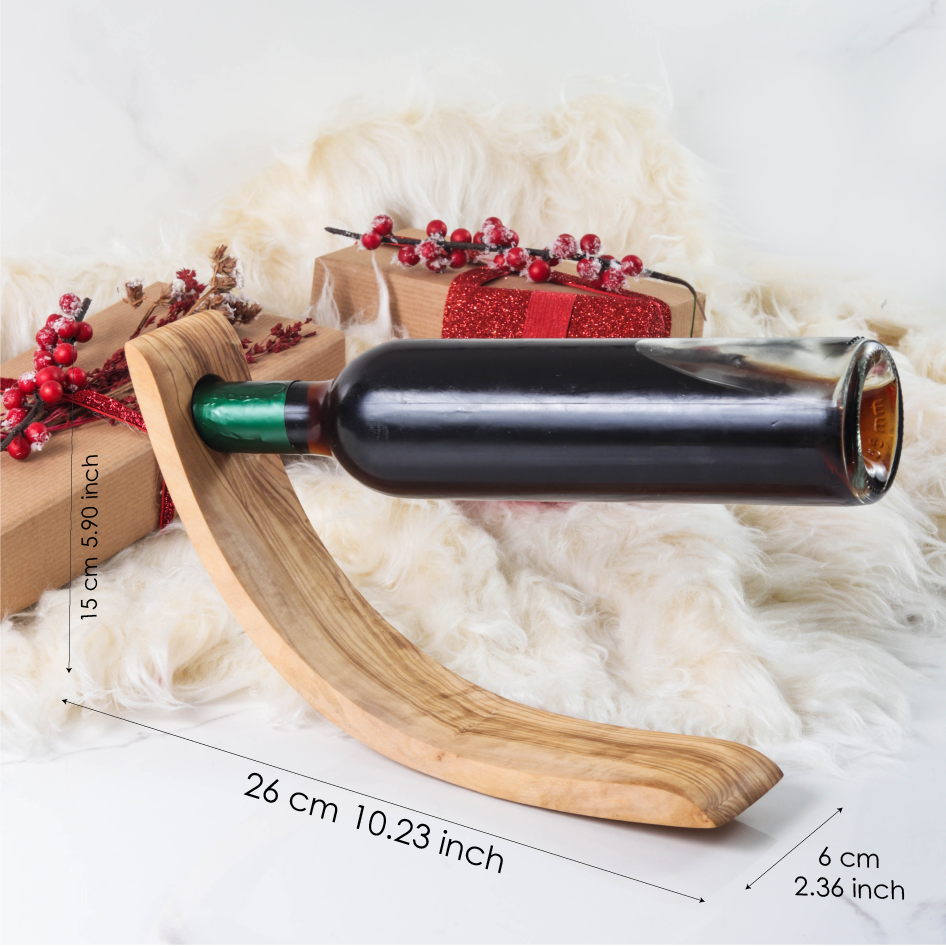 Dimensions of this bottle holder handmade from olive wood: length: 10.2" Inch (26cm) Width: 2.4" (6cm), Height: 5.9" (15cm)