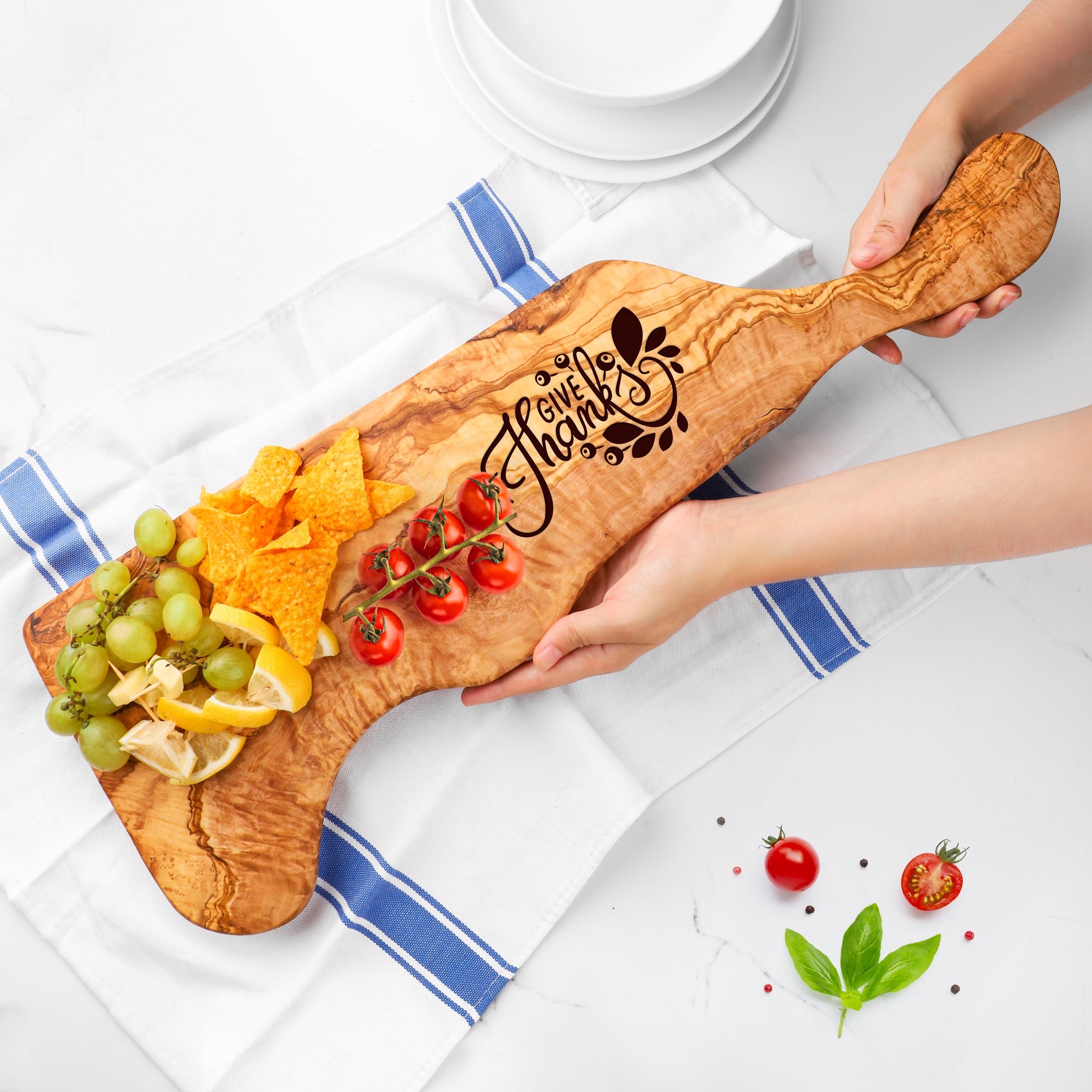 Durable Wooden Cheese Board from Olive Wood: Ideal for arranging cheeses, fruits, and meats, this board combines the strength of olive wood with a generous surface area, making it a stylish and practical addition to any kitchen or dining area