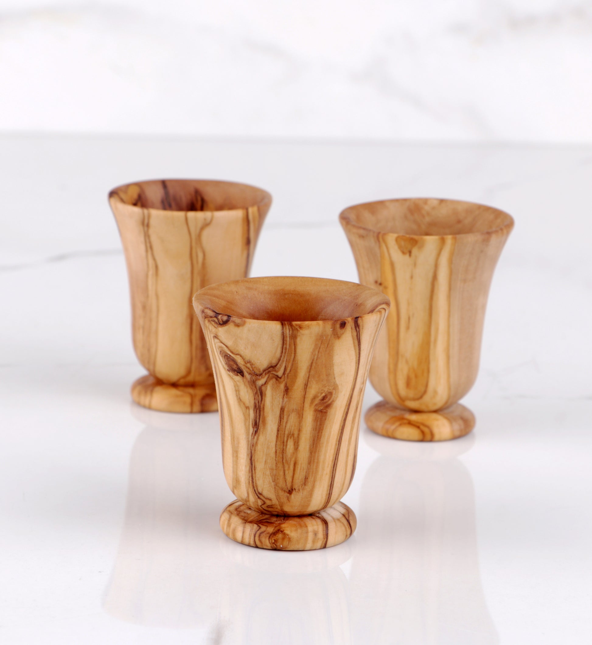 Elevate your celebrations with this Set of 6 Handmade Olive Wood Shot Glasses, the perfect addition to your festive occasions. Each glass showcases the natural beauty of olive wood, making your holiday toasts uniquely memorable.