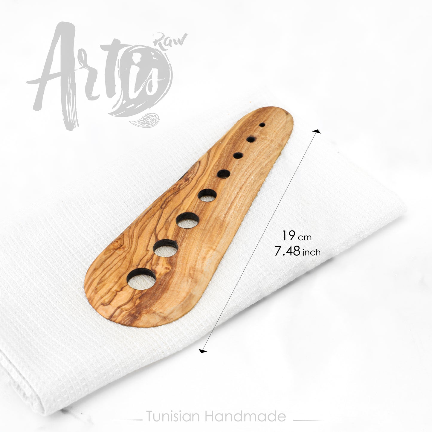 Close-up of olive wood herb stripper grooves for efficient herb stripping