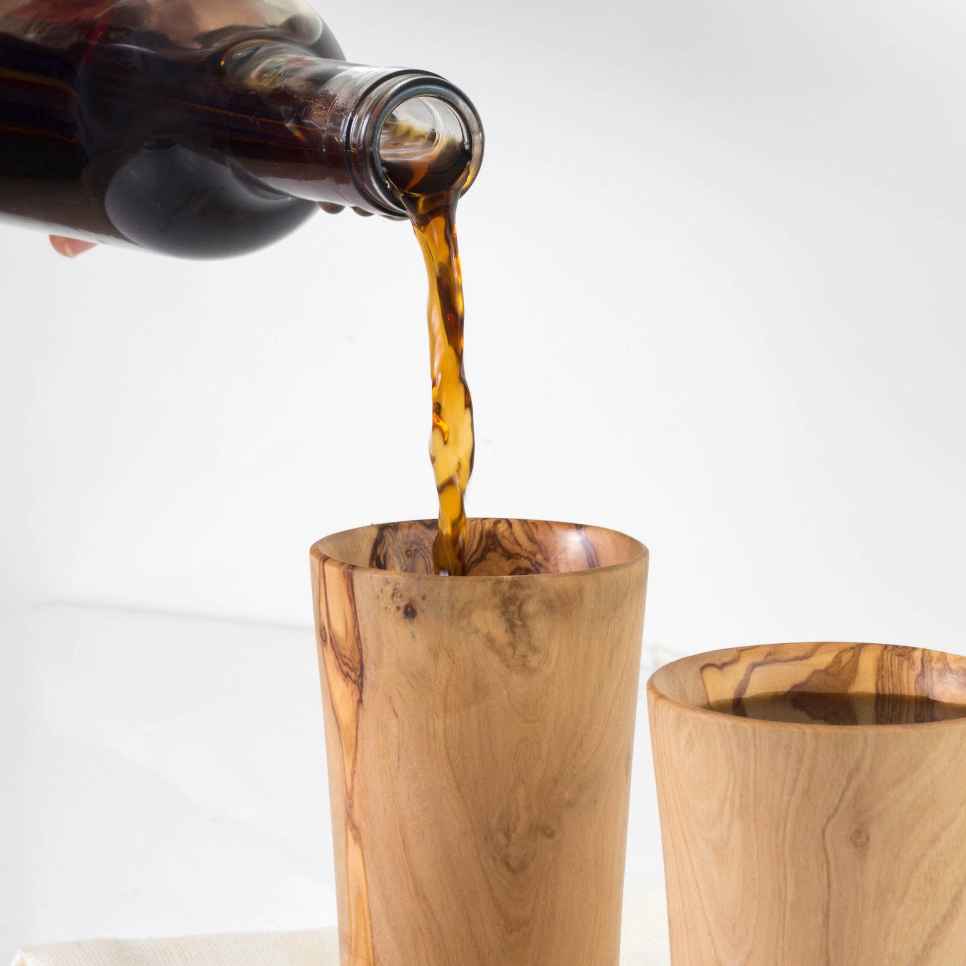 Handcrafted Olive Wood Drinkware: Elevate your beverage experience with this eco-friendly wooden cup. Its versatile design suits any table setting, offering both beauty and functionality.