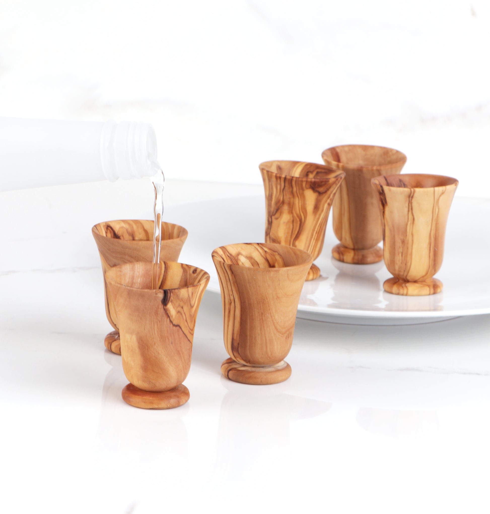 Experience the joy of gifting with this Olive Wood Shot Glasses Set, a perfect present for birthdays, weddings, or as a standout Christmas gift. Celebrate in style with a shot glass that's as special as the occasion.