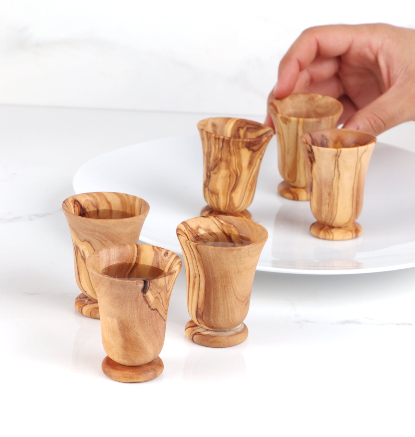 Ideal for Christmas, these durable wooden shot glasses add a rustic charm to your celebrations. Handcrafted from Mediterranean olive wood, they're not only beautiful but built to last for countless joyful moments.