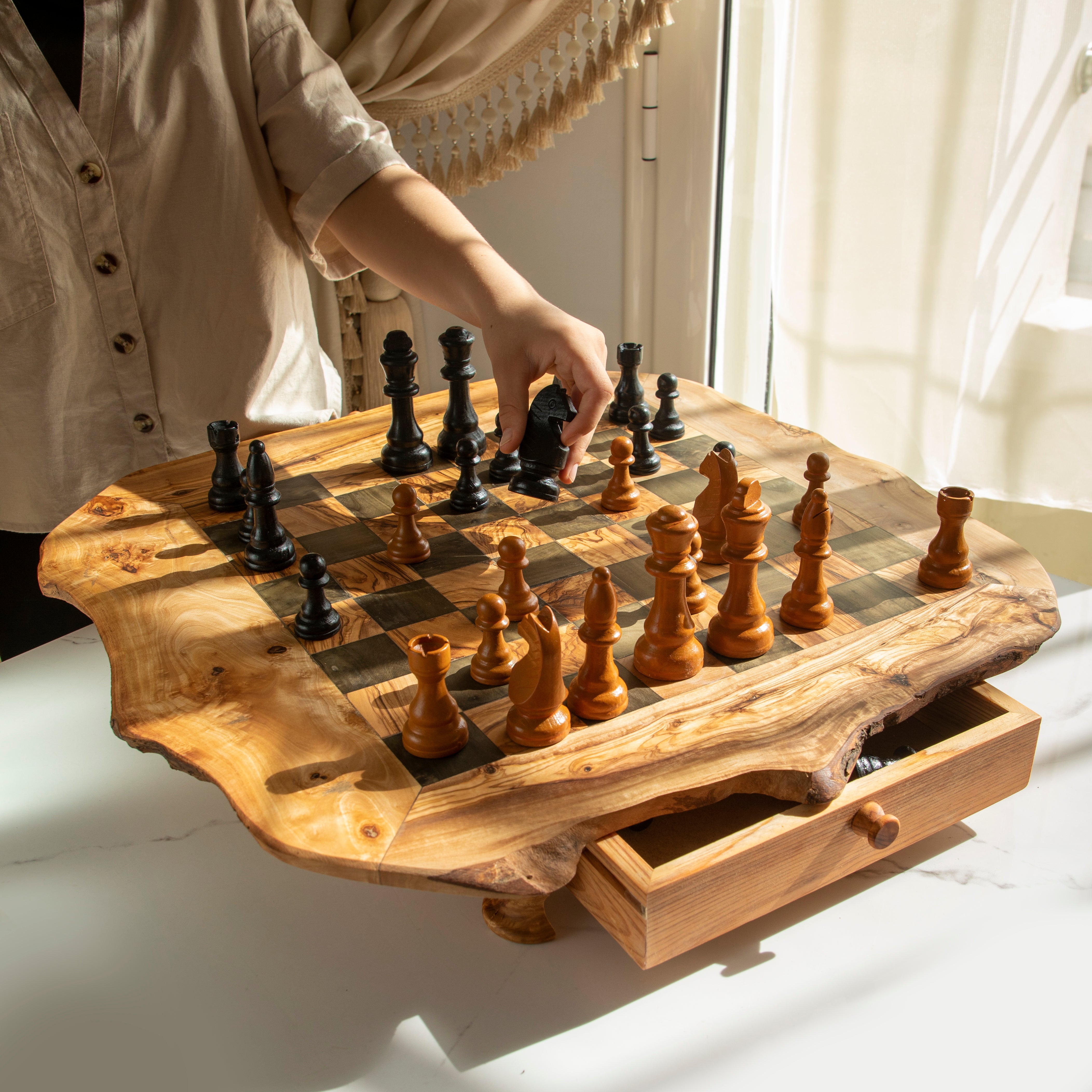 Handmade wooden chess set – close-up of olive wood grain and chess pieces