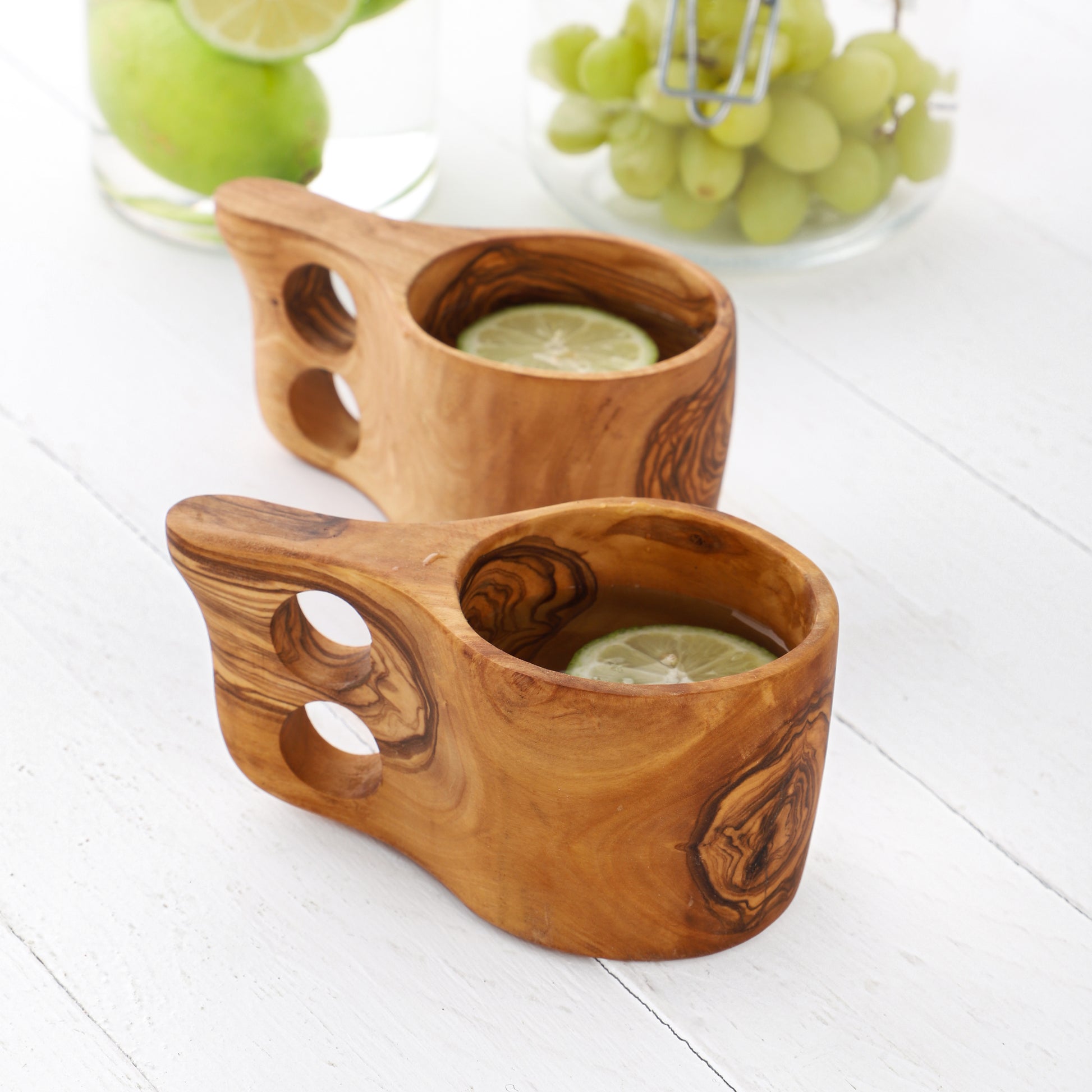 Unique Wooden Mug for Outdoor Adventures, made from olive wood with a naturally insulating design and a comfortable, dual-hole handle, showcasing the beauty of handcrafted Tunisian drinkware.