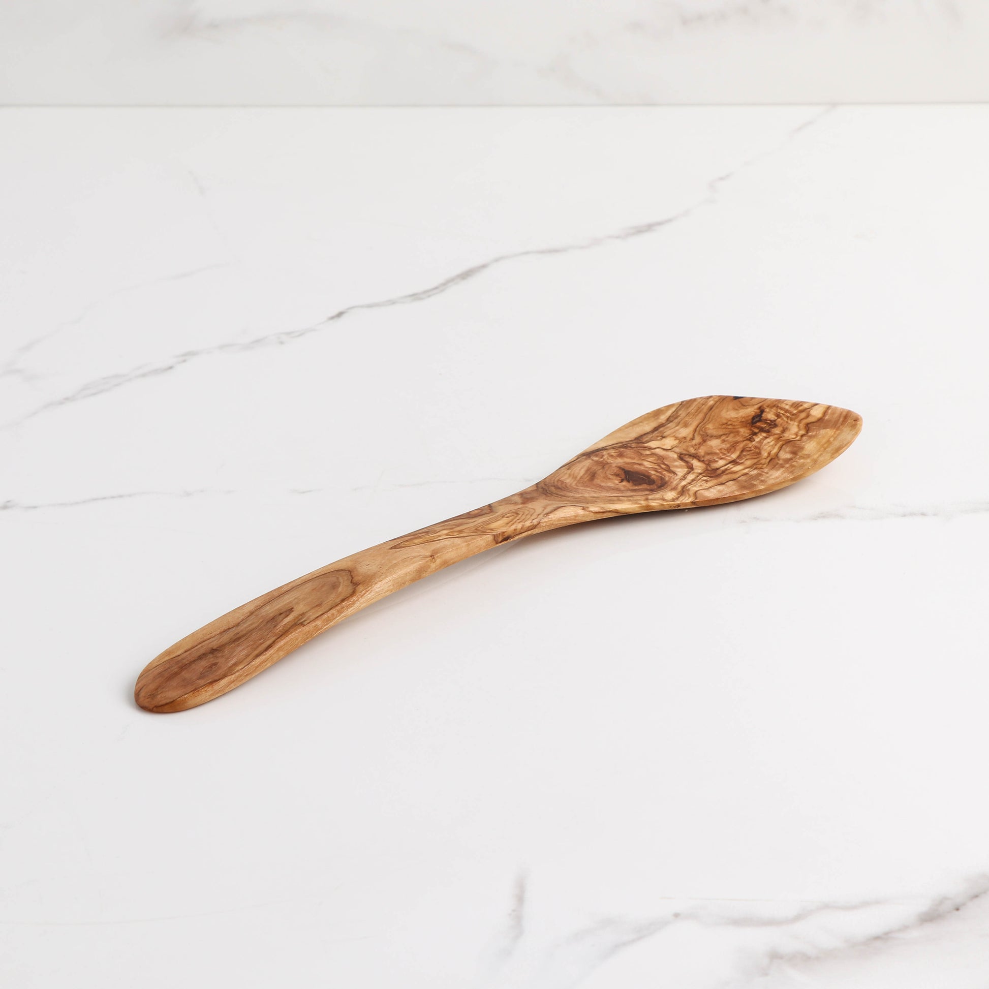 Unique Olive Wood Kitchen Spatula: Handmade with care, this spatula combines robust construction with a curved design for optimal functionality. Ideal for cooking enthusiasts seeking a blend of utility and natural beauty in their utensils