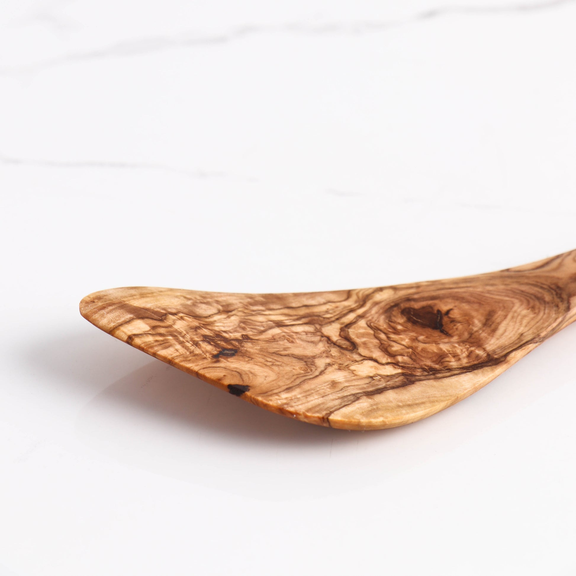 Durable and Stylish Olive Wood Cooking Utensil: This curved corner spatula is crafted for efficient cooking and long-lasting use. Its hand-carved design ensures no two pieces are alike, offering a unique tool for everyday culinary tasks