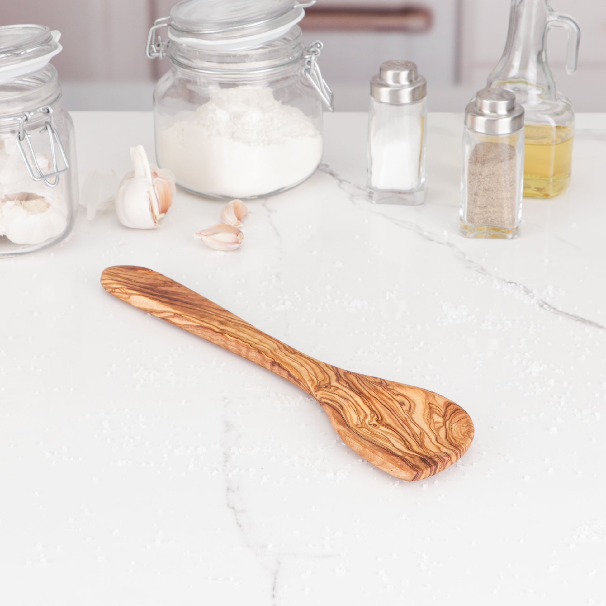 Versatile Olive Wood Corner Cooking Spoon, handcrafted for precision in pots and pans. Its durable construction and unique design make it an ideal gift for culinary enthusiasts, adding a touch of artisanal craftsmanship to any kitchen.