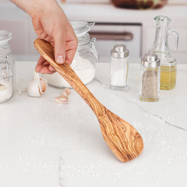 Elegant Olive Wood Cooking Utensil, designed for versatility in the kitchen. This corner spoon's ergonomic shape ensures comfortable stirring and scraping, making cooking easier. Handcrafted to last, it's an essential tool for every home cook.
