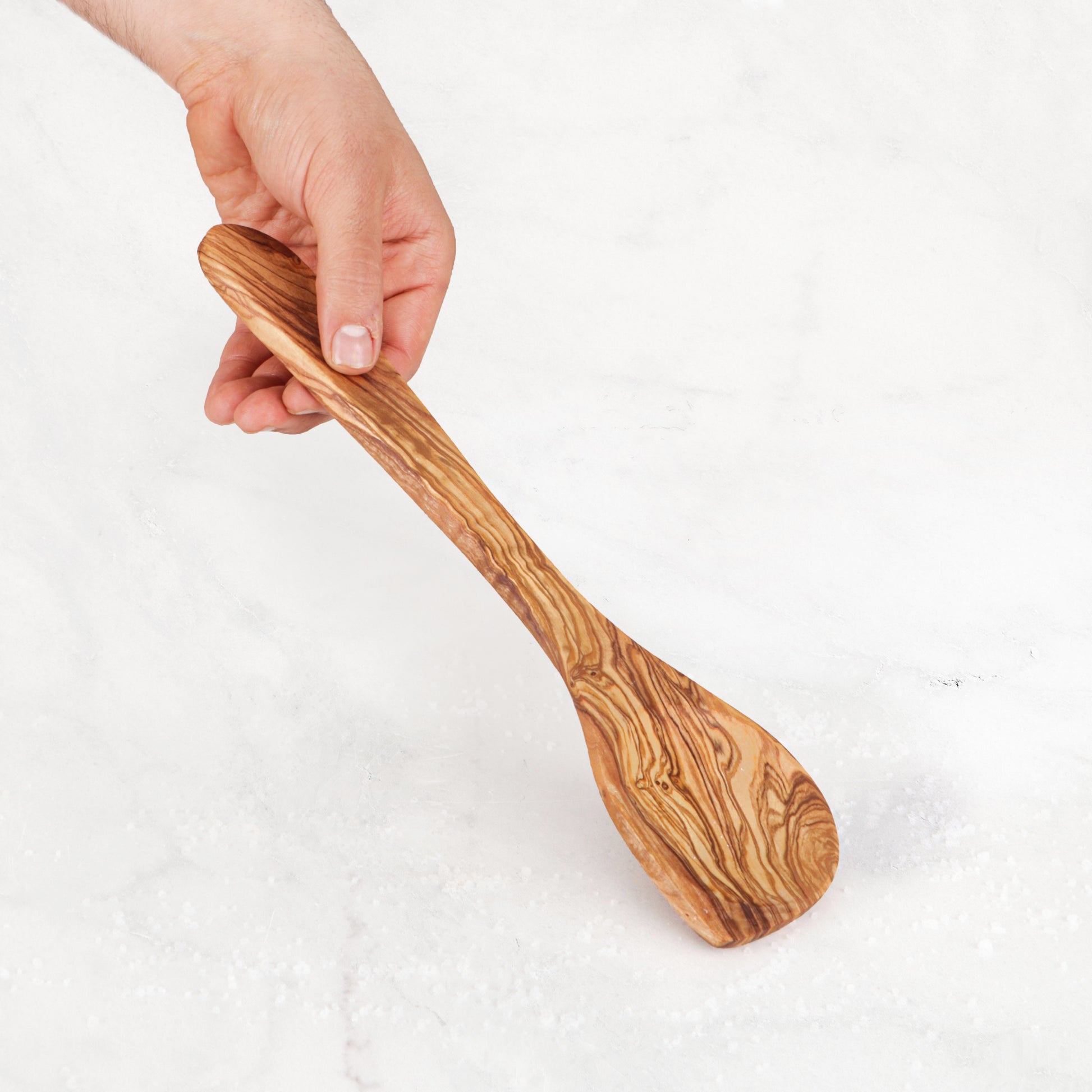Handmade Olive Wood Corner Spoon: A durable and artistically carved wooden spoon for cooking, perfect for stirring and reaching into corners. Unique grain patterns add rustic charm to your kitchen utensils collection, combining beauty with practicality.