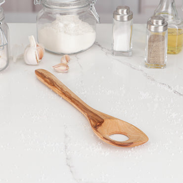 Hand-carved olive wood risotto spoon with a unique design featuring a hole for easy stirring, ensuring perfect risotto texture. Each spoon showcases the rich, natural grain patterns and hues of olive wood, making it a one-of-a-kind cooking utensil. Durable, antibacterial, and resistant to moisture, this spoon combines functionality with rustic charm, enhancing any culinary experience and kitchen décor