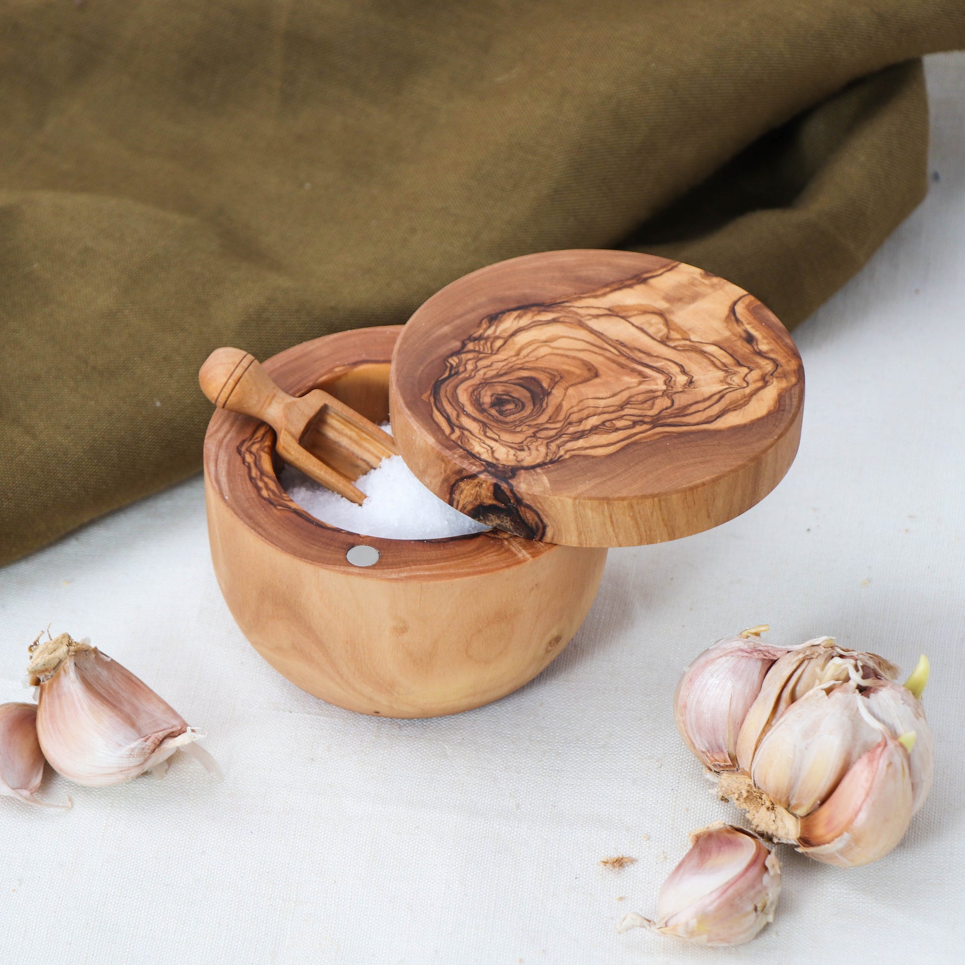 Unique Gift for Food Enthusiasts: Wooden Salt Cellar with Magnetic Lid. Ideal for anyone looking to upgrade their kitchen essentials with a blend of style and functionality. This salt box comes with a wooden spoon, offering an elegant solution to seasoning needs.