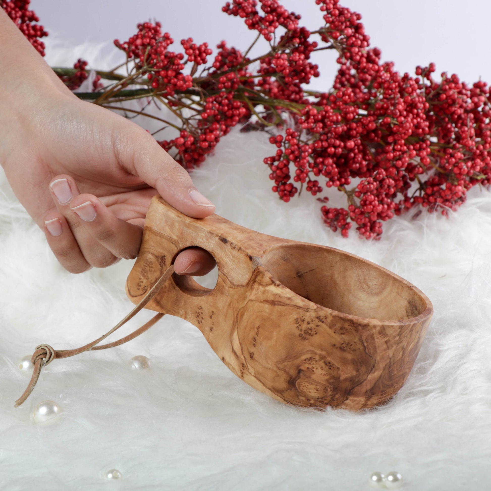 Handcrafted Tunisian Olive Wood Kuksa Mug: Embrace the natural beauty and durability of this unique kuksa cup, perfect for enjoying your favorite drinks during outdoor adventures or cozy evenings at home. A traditional touch to your drinkware collection.