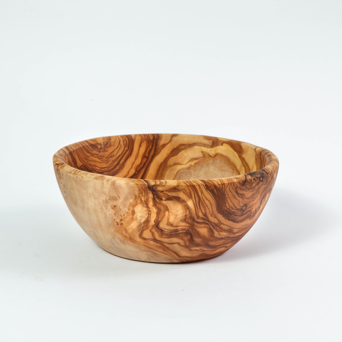 Large Olive Wood Salad Bowl, handcrafted with unique grain and warm tones, perfect for an eco-friendly kitchen. Its ample size is ideal for serving salads or fruit, adding rustic charm to any meal.