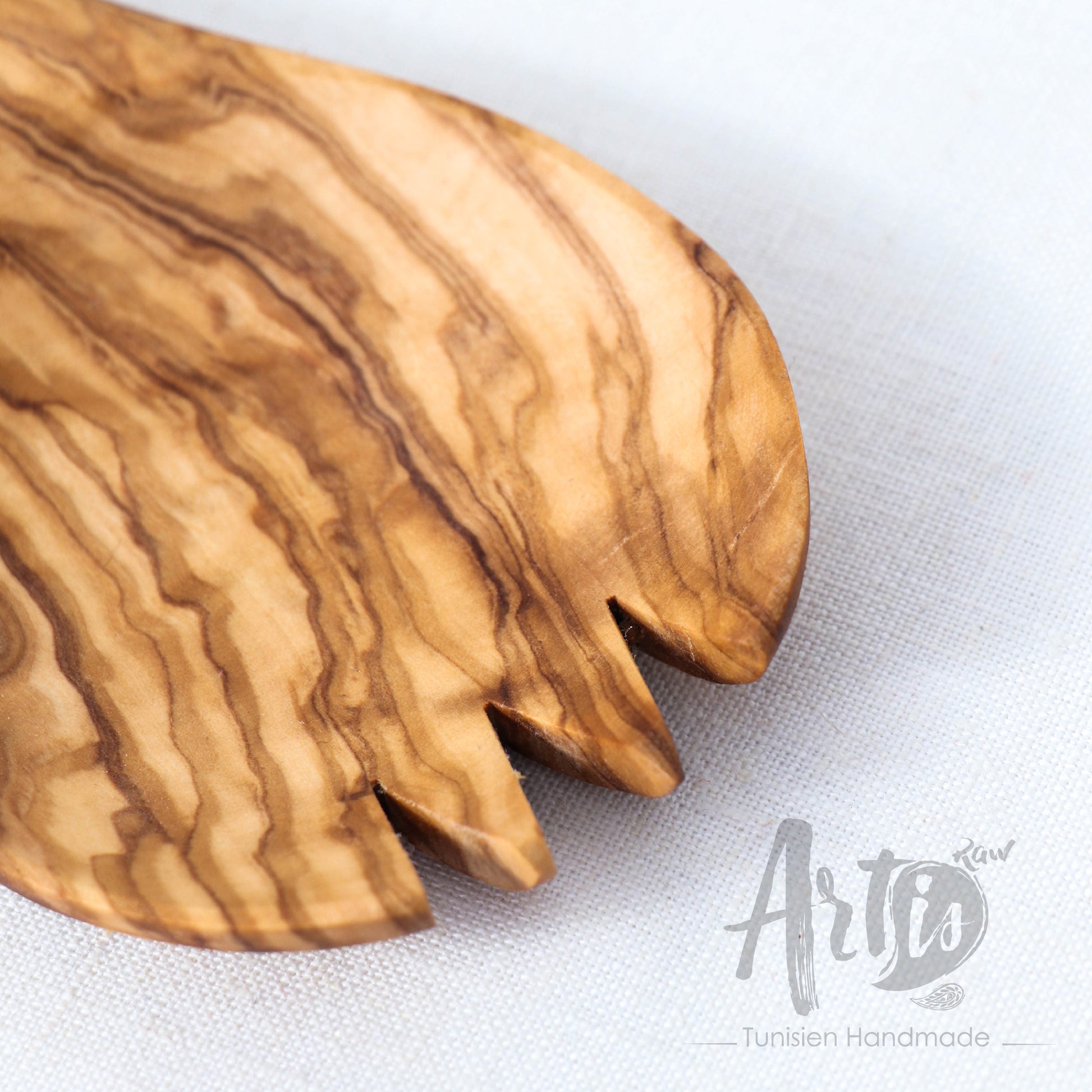 Eco-friendly olive wood serving spork, blending sustainability with practical design. Ideal for salads, pastas, and various dishes, this versatile party utensil is meticulously crafted by skilled artisans, offering a unique, high-quality addition to your serving collection. Its renewable material underlines an eco-conscious choice for stylish hosting.