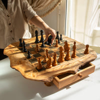 Handmade wooden chess set – close-up of olive wood grain and chess pieces