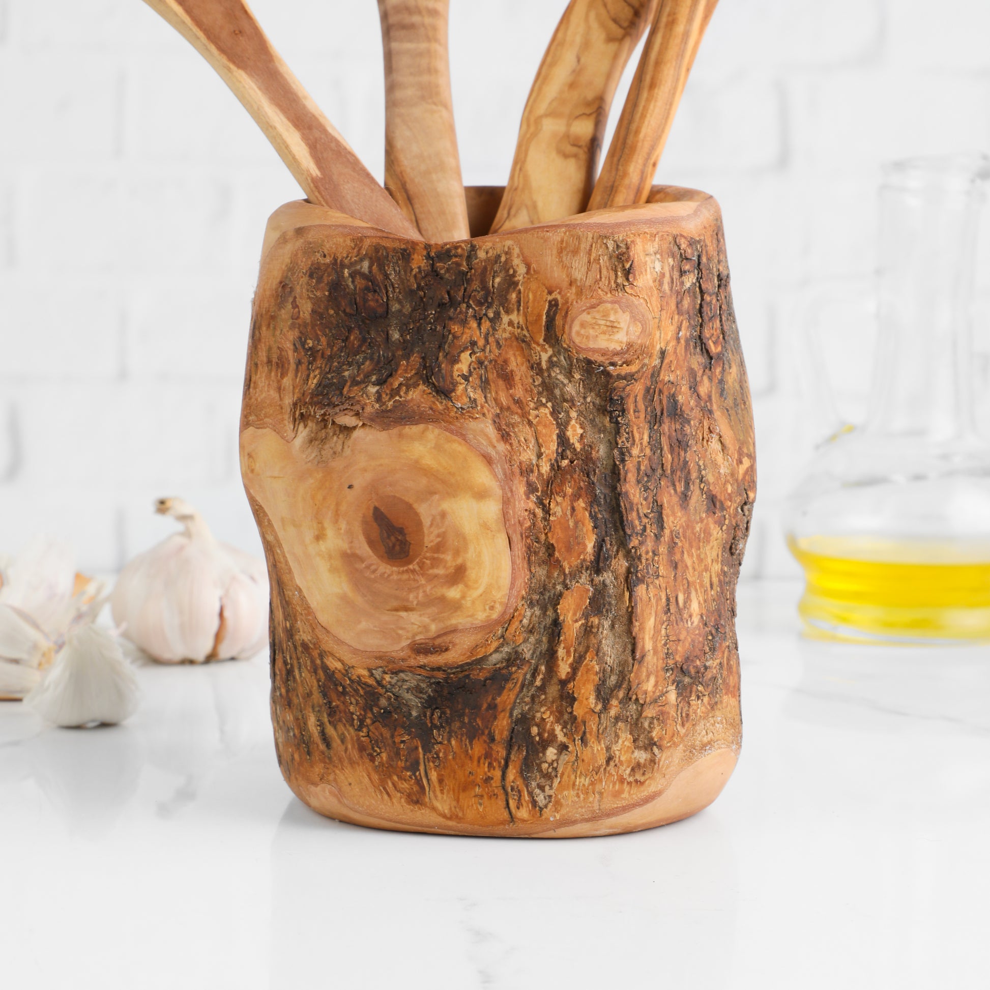 Olive wood utensil set with tree trunk holder and four cooking spoons