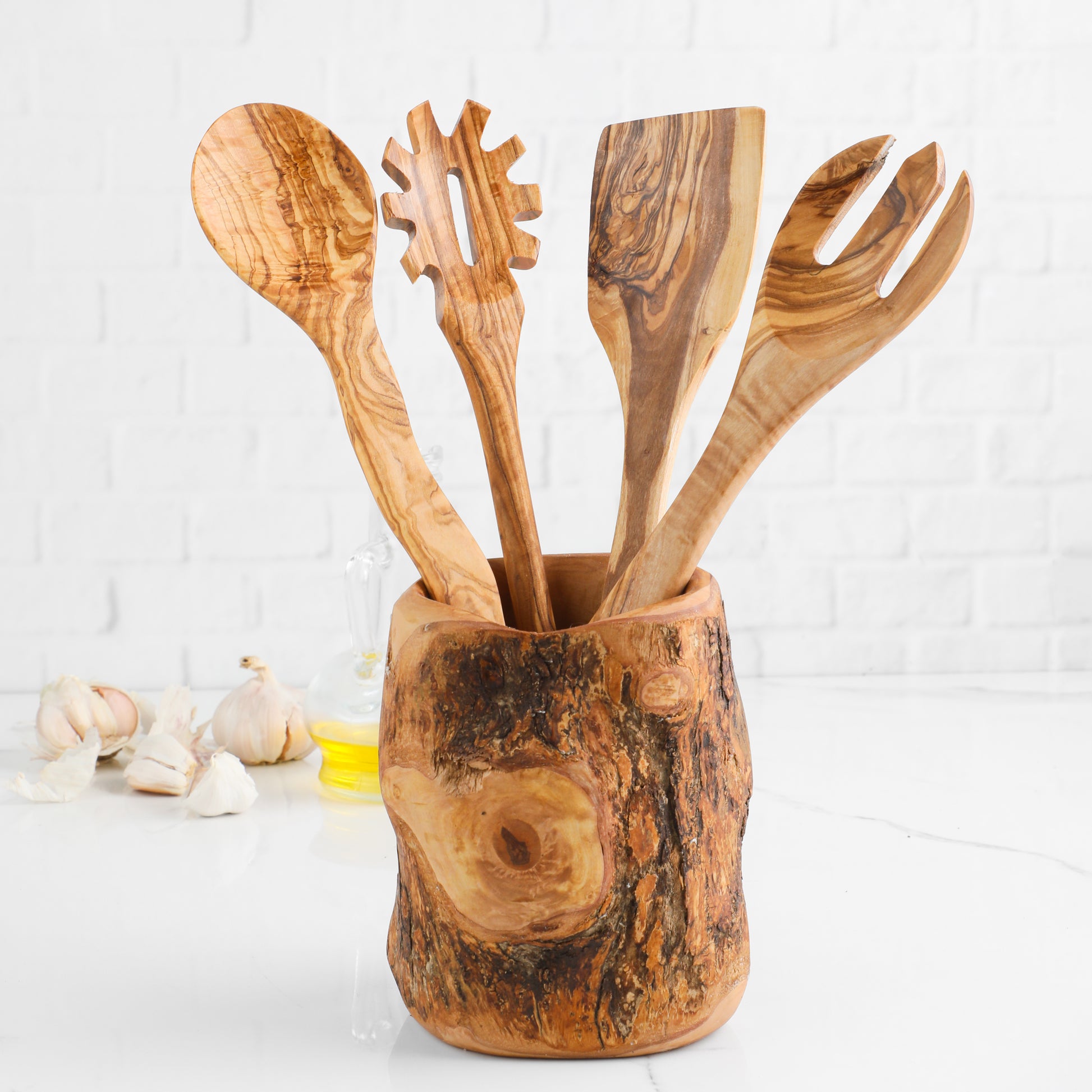 Olive wood utensil set with tree trunk holder and four cooking spoons