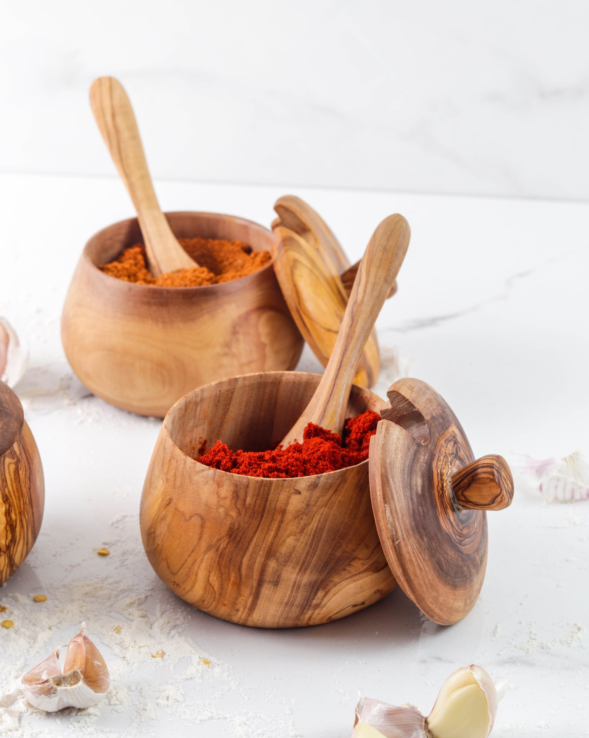Olive wood salt cellar with removable lid and matching wooden spoon