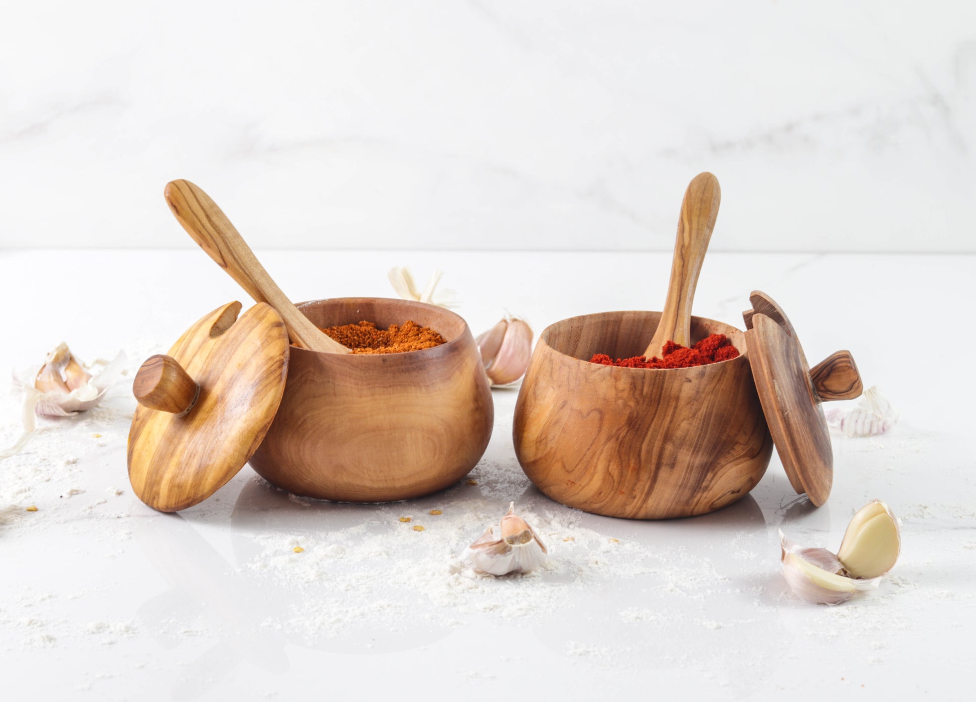 Olive wood salt cellar with removable lid and matching wooden spoon