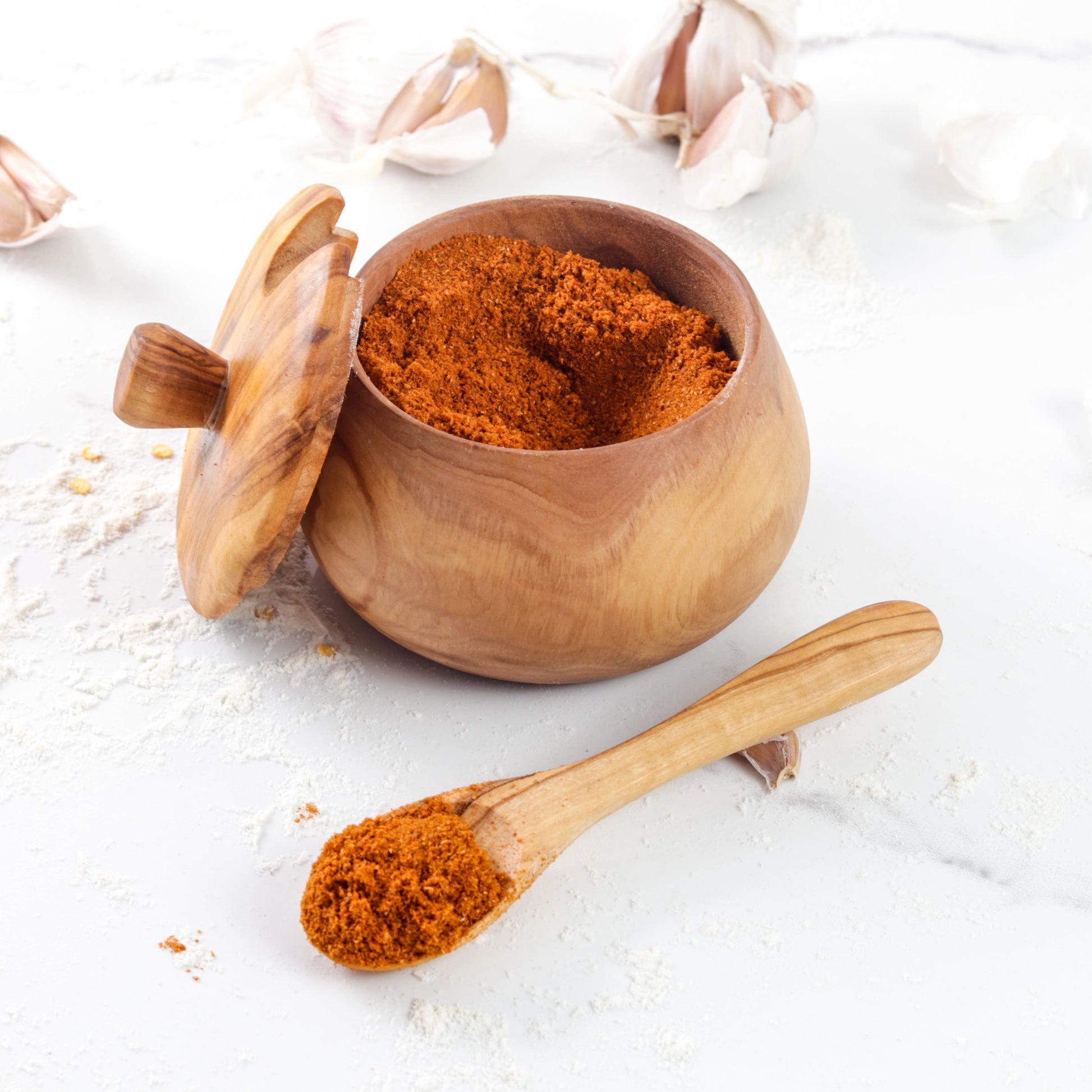 Olive wood salt cellar with removable lid and matching wooden spoon