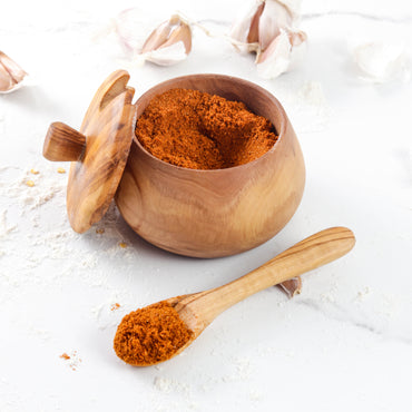 Olive wood salt cellar with removable lid and matching wooden spoon